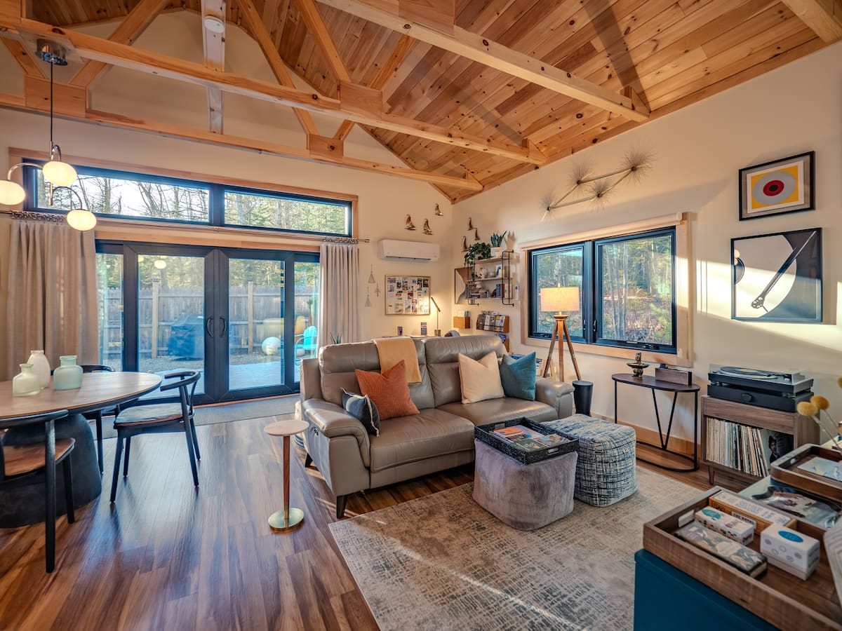 Open living area with vaulted pine ceiling